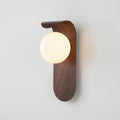 Wooden wall sconce with a round light bulb on a plain background