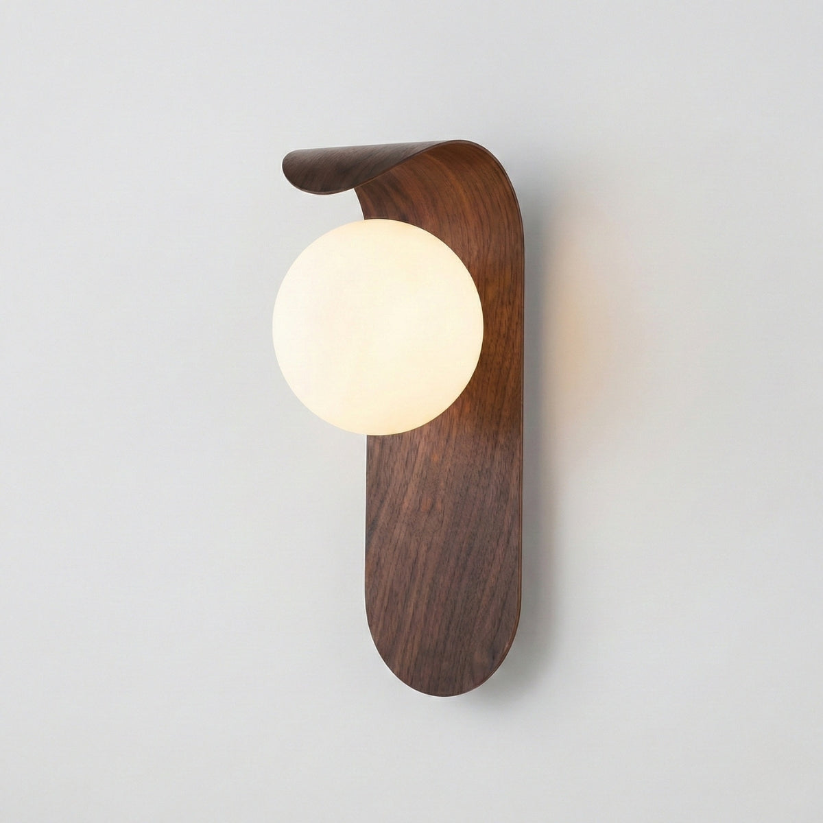 Wooden wall sconce with a round light bulb on a plain background
