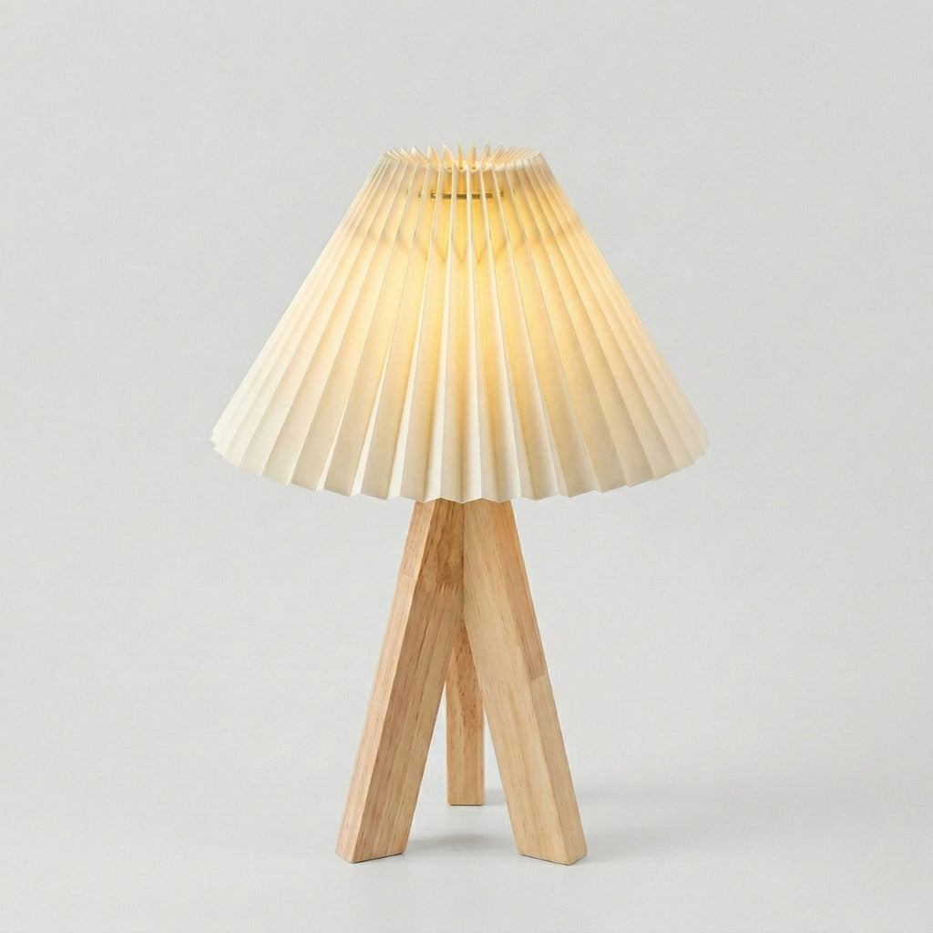 Wooden table lamp with pleated shade on a light gray background