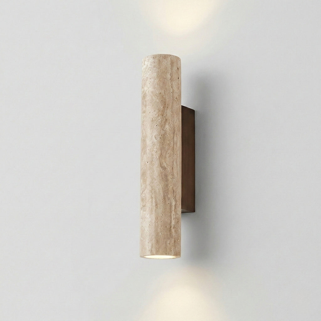 Cylindrical wall light fixture on a plain wall
