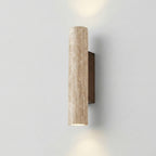 Cylindrical wall light fixture on a plain wall