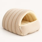 cave cat bed with padded interior in beige