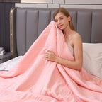 cool-touch quilted blanket in pink