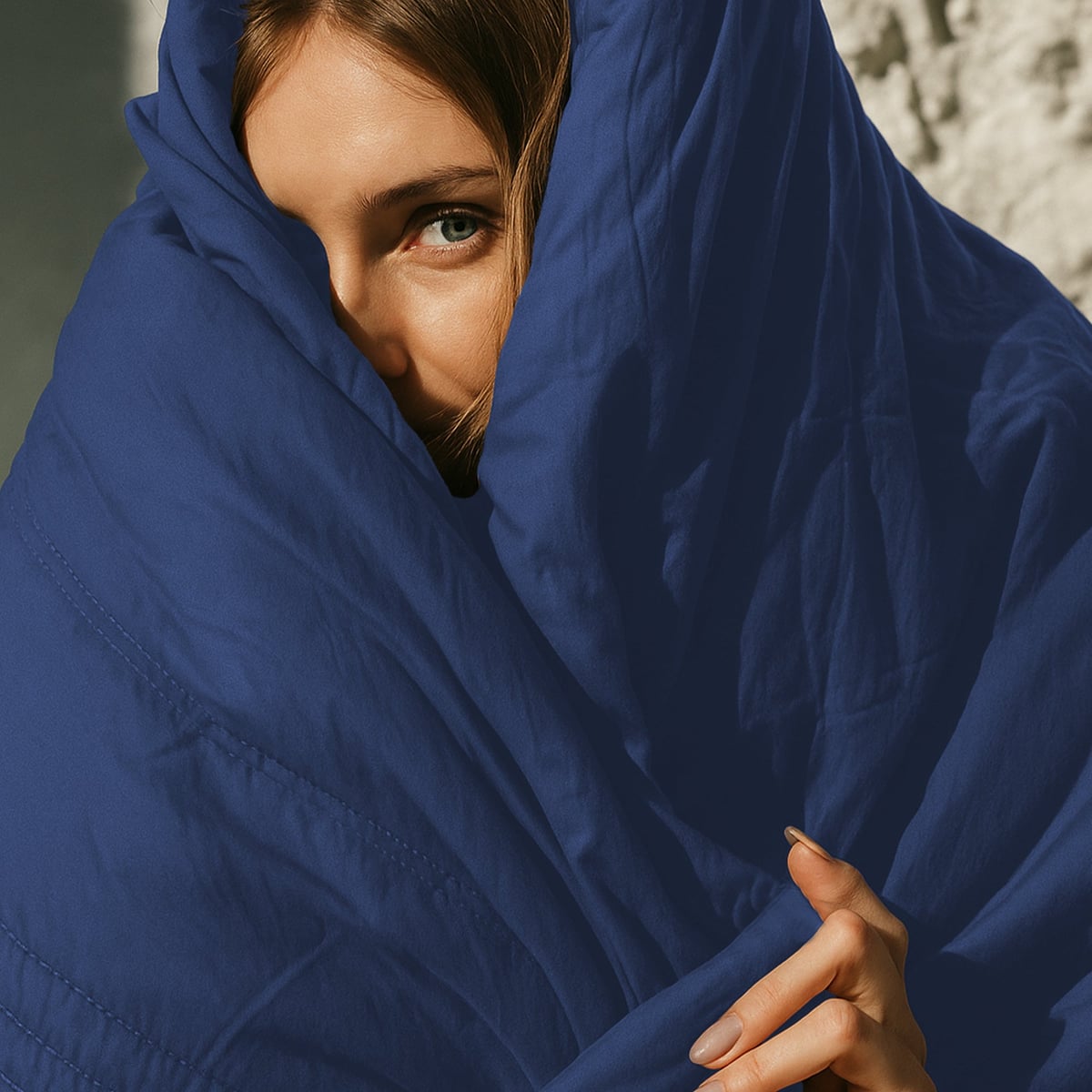 cool-touch quilted blanket in dark blue