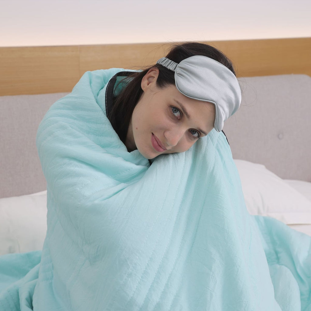 cool-touch quilted blanket in aquamarine