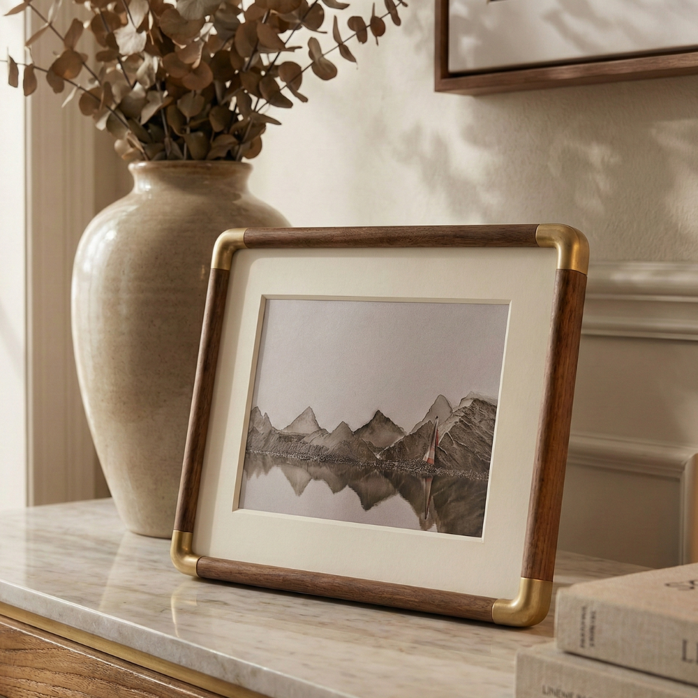freestanding photo frame with gold corner detail in black walnut