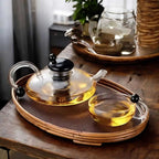 glass teapot set with cups in transparent