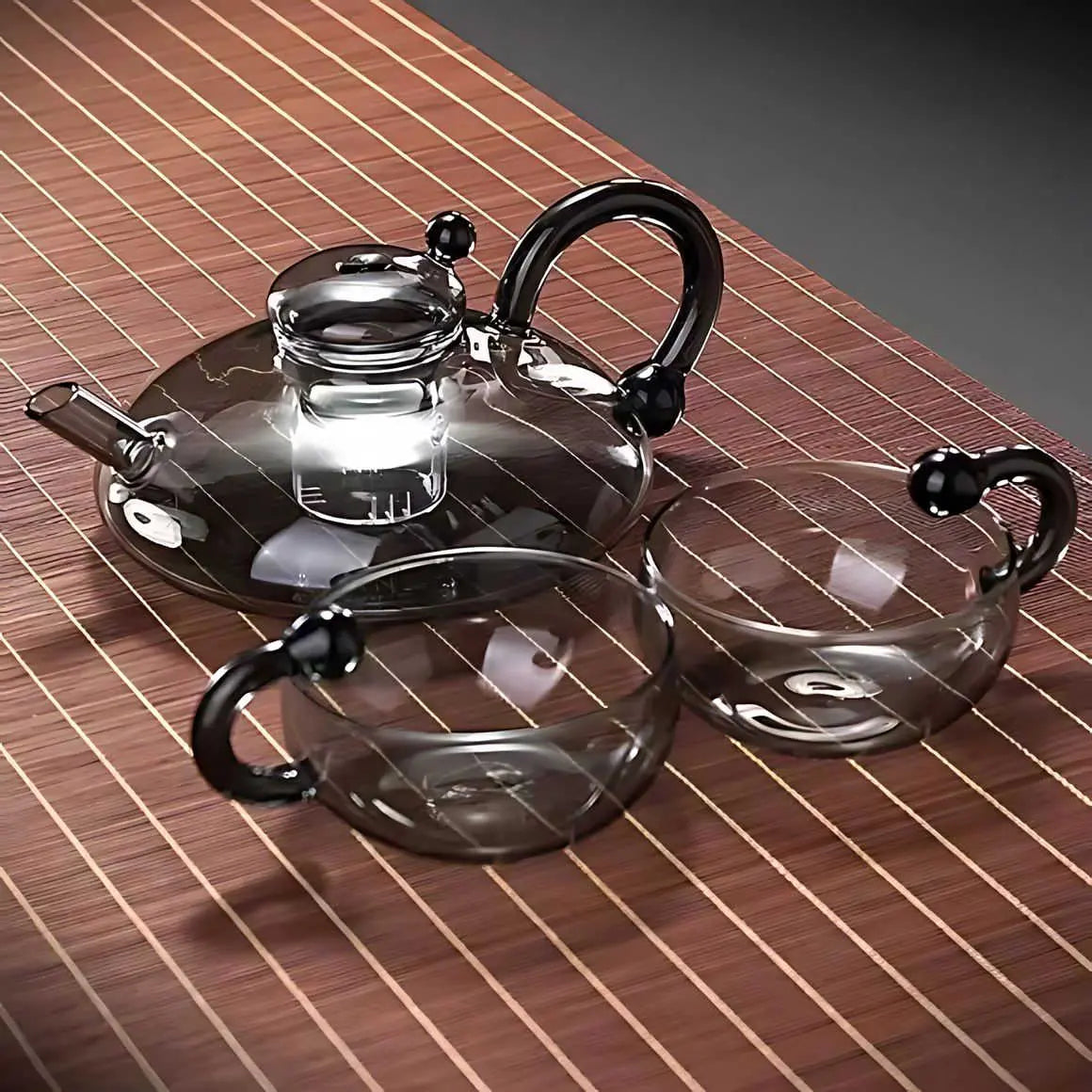 glass teapot set with cups in gray