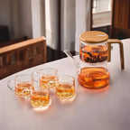 glass teapot with infuser and wooden handle