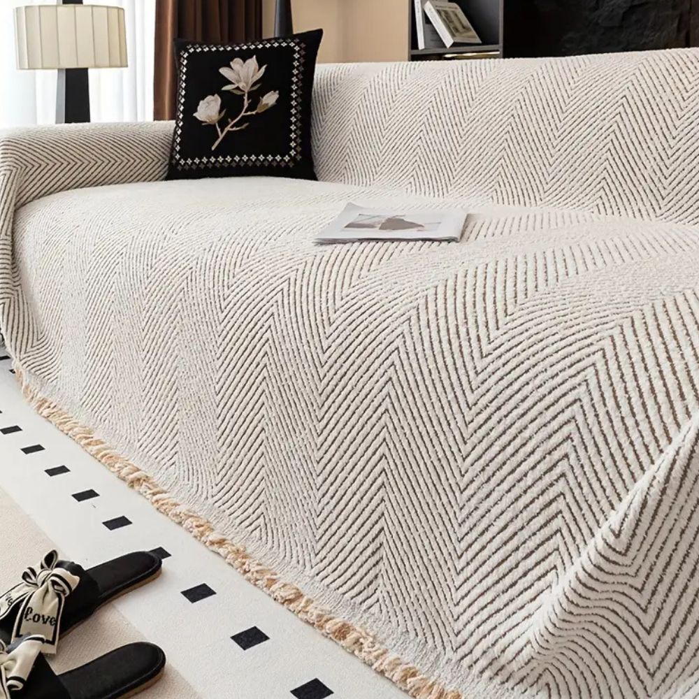 herringbone sofa cover with fringe trim in ivory sand