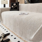 herringbone sofa cover with fringe trim in ivory sand
