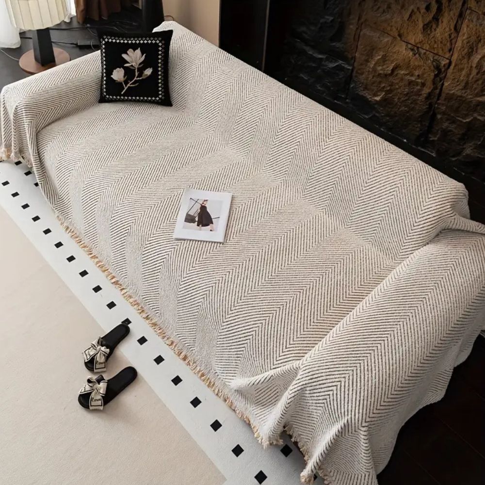 herringbone sofa cover with fringe trim in ivory sand
