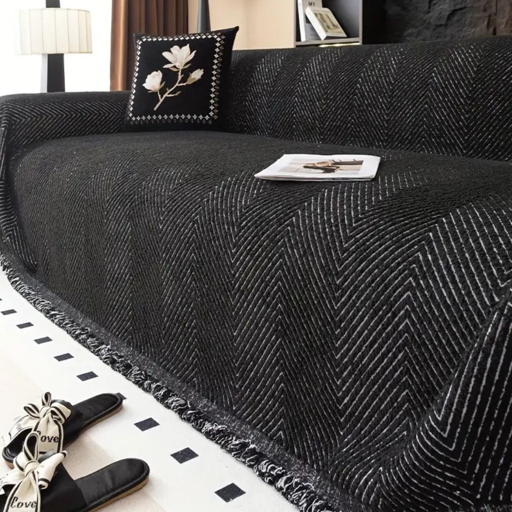herringbone sofa cover with fringe trim in midnight black