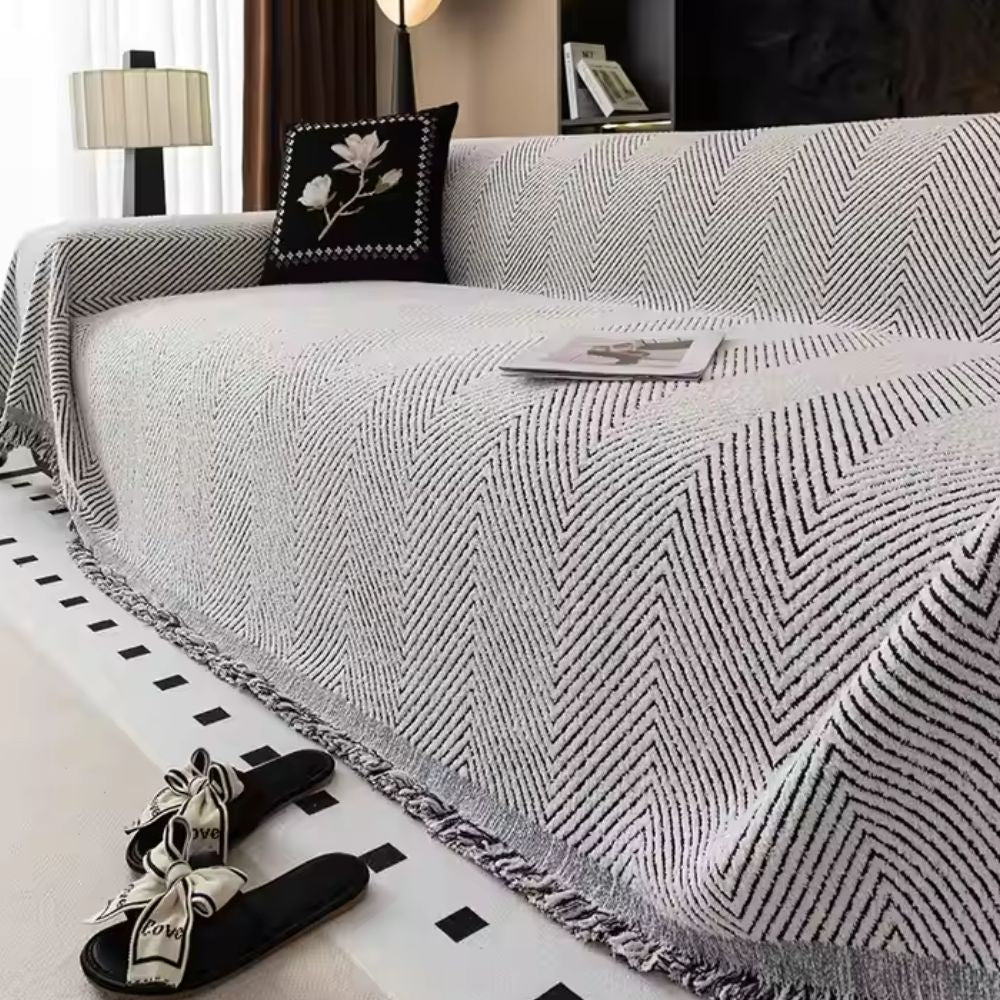herringbone sofa cover with fringe trim in charcoal weave