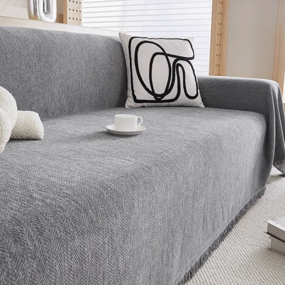 herringbone sofa cover with tassels in grey