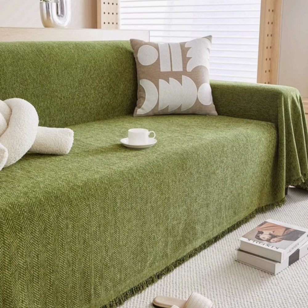 herringbone sofa cover with tassels in green