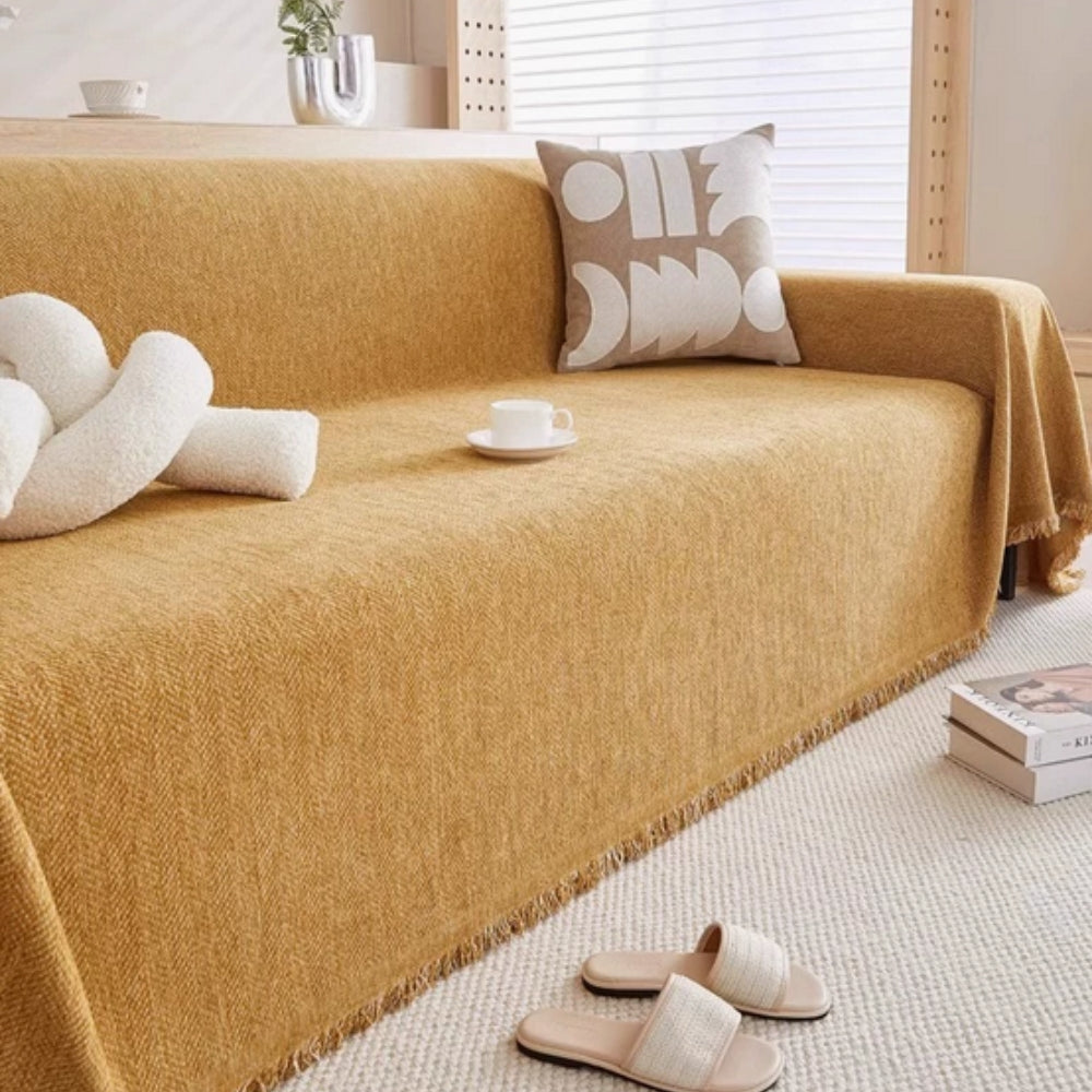 herringbone sofa cover with tassels in orange
