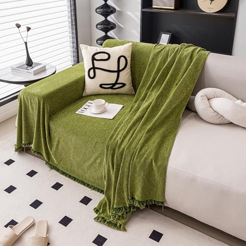 herringbone sofa cover with tassels in green