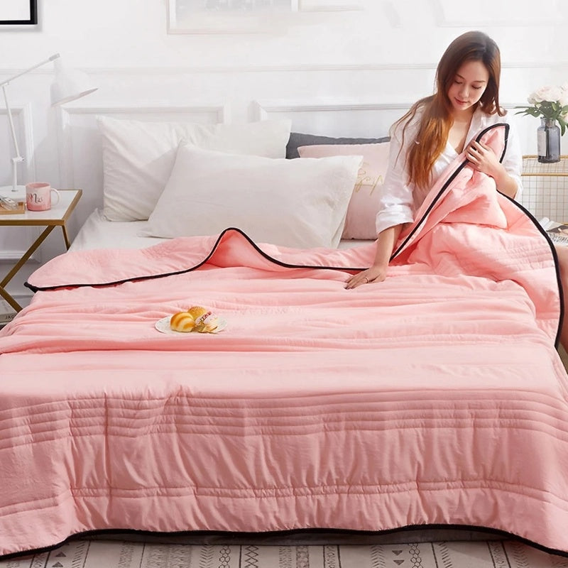lightweight quilted cooling blanket in pink