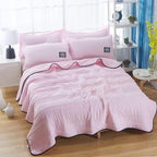 lightweight quilted cooling blanket in blush pink