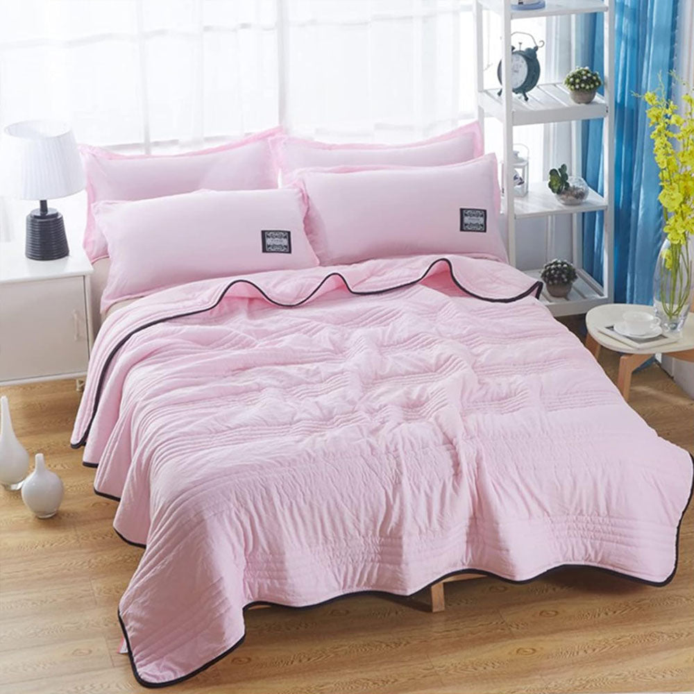 lightweight quilted cooling blanket in blush pink