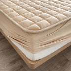 quilted fitted mattress protector in beige