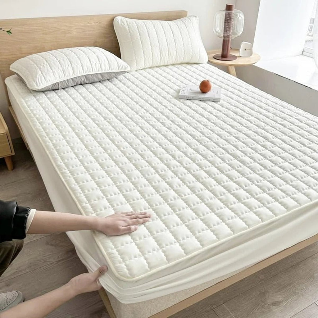 quilted fitted mattress protector in white