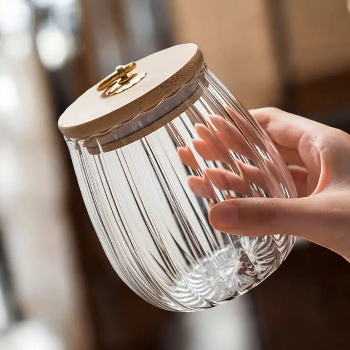 ribbed glass storage jar with wooden lid