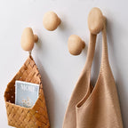 round wall-mounted pebble hooks in beach