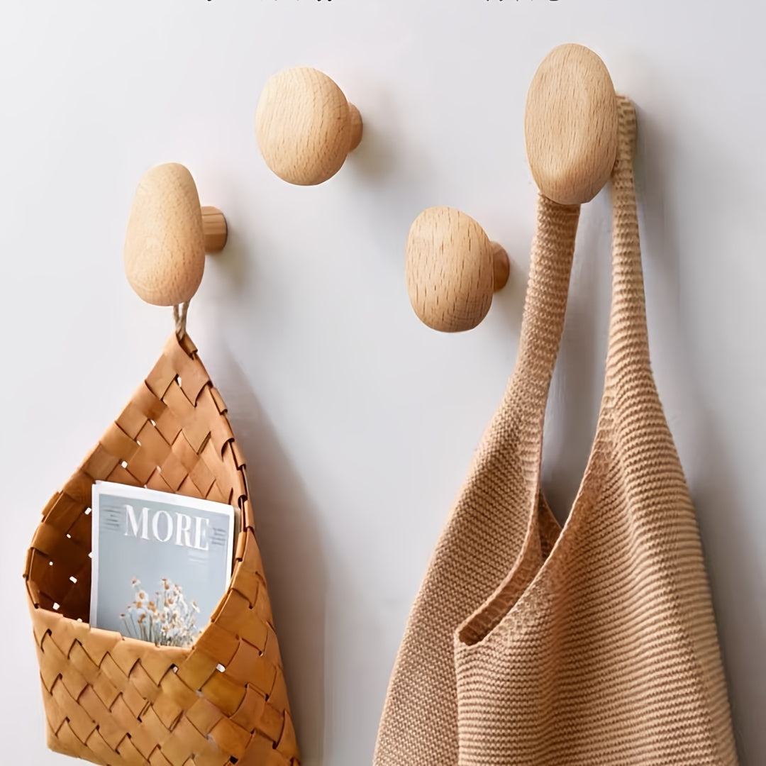 round wall-mounted pebble hooks in beach