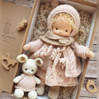 waldorf doll with knitted outfit and gentle animal companion