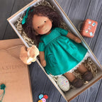 waldorf doll with knitted outfit and gentle animal companion