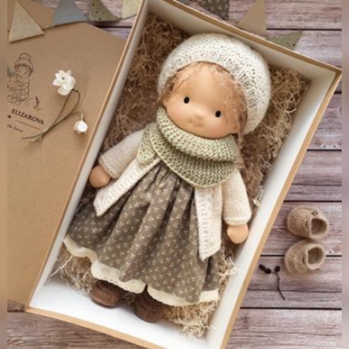 waldorf doll with knitted outfit and gentle animal companion