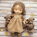 waldorf doll with knitted outfit and gentle animal companion