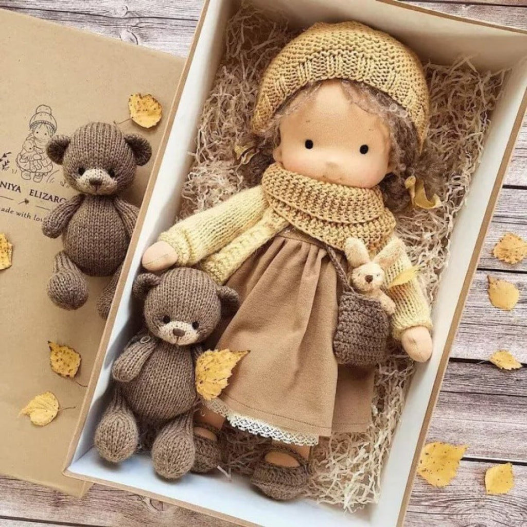 waldorf doll with knitted outfit and gentle animal companion