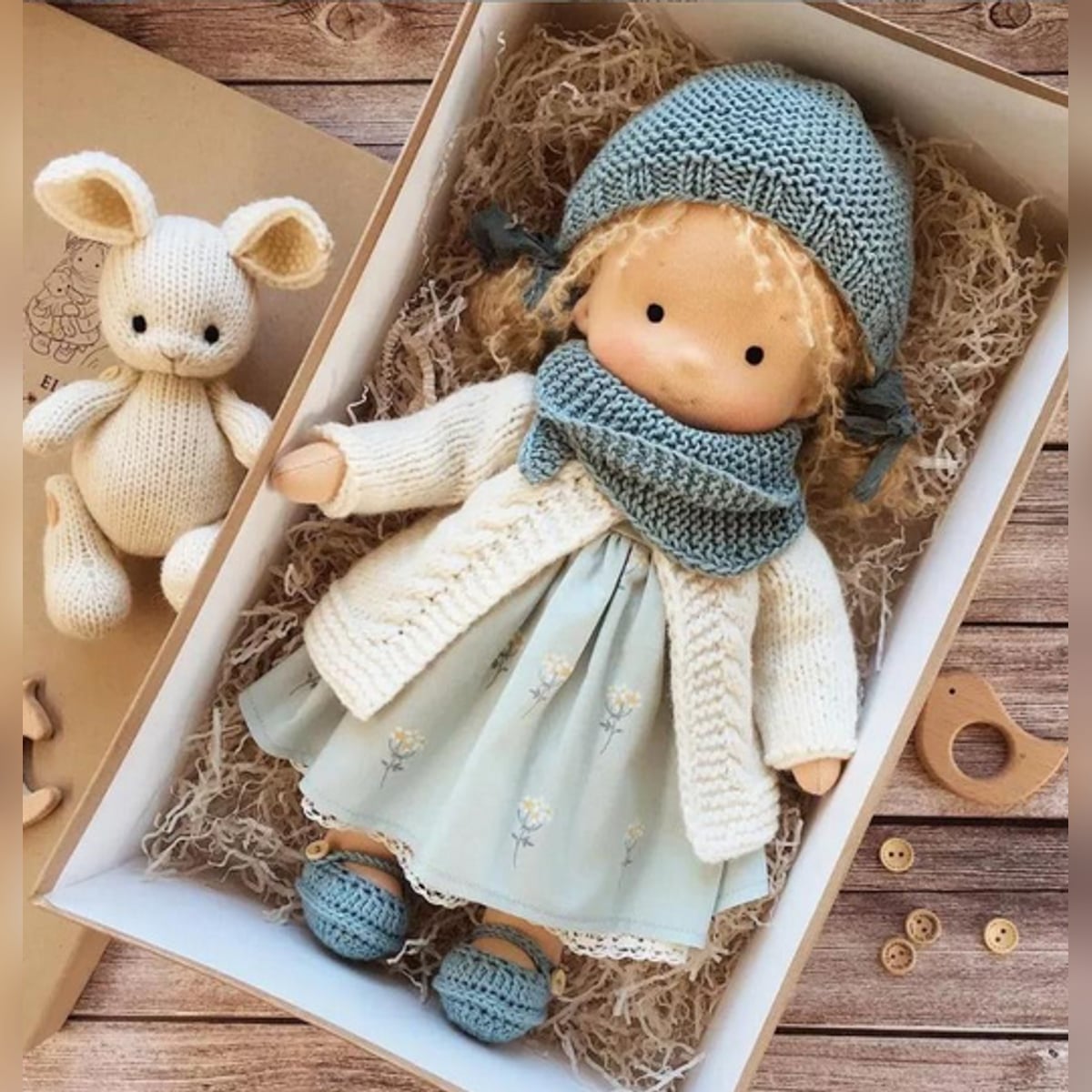waldorf doll with knitted outfit and gentle animal companion