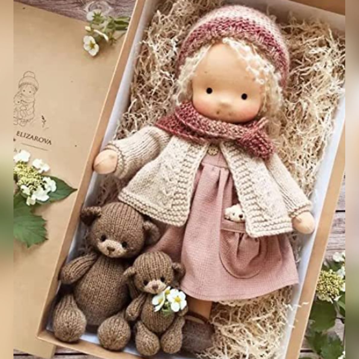 waldorf doll with knitted outfit and gentle animal companion