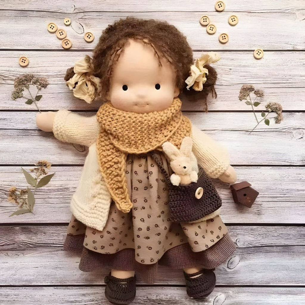 waldorf doll with knitted outfit and gentle animal companion