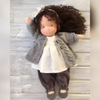 waldorf doll with knitted outfit and gentle animal companion
