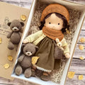 waldorf-style rag doll with knitted outfit
