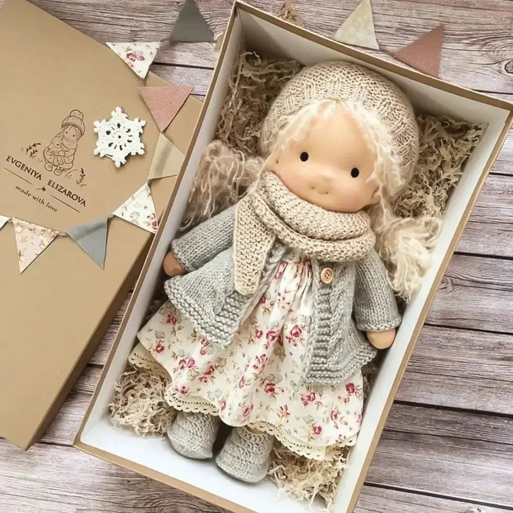 waldorf-style rag doll with knitted outfit