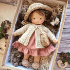 waldorf-style rag doll with knitted outfit