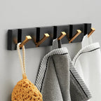 wall-mounted folding hook rail in gold