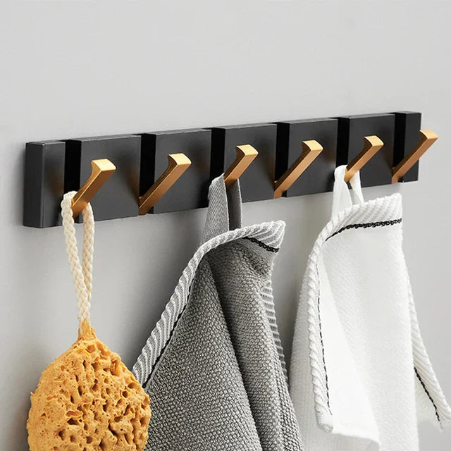 wall-mounted folding hook rail in gold