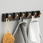 wall-mounted folding hook rail in gold