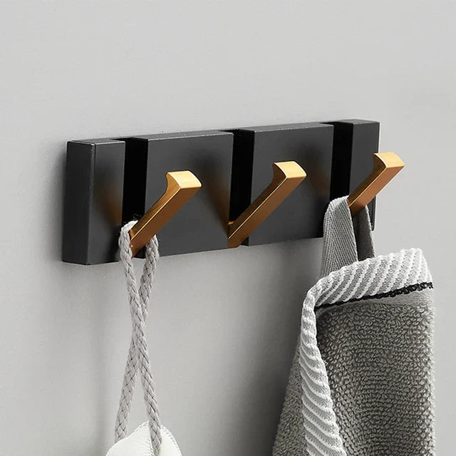 wall-mounted folding hook rail in gold