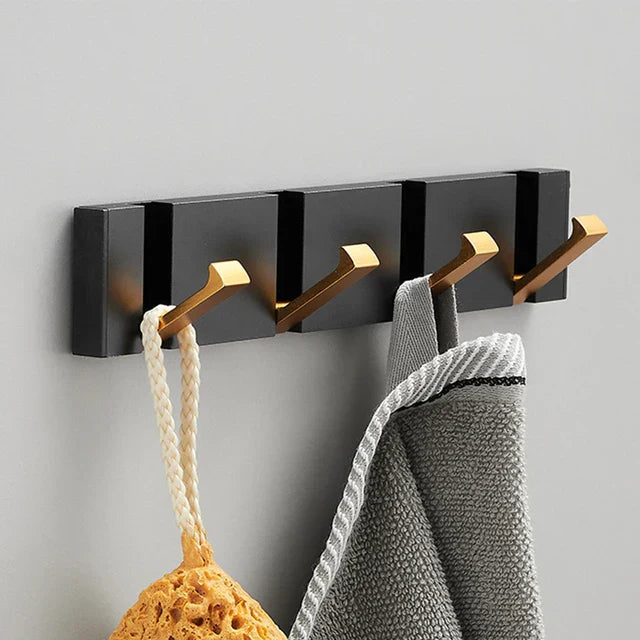 wall-mounted folding hook rail in gold