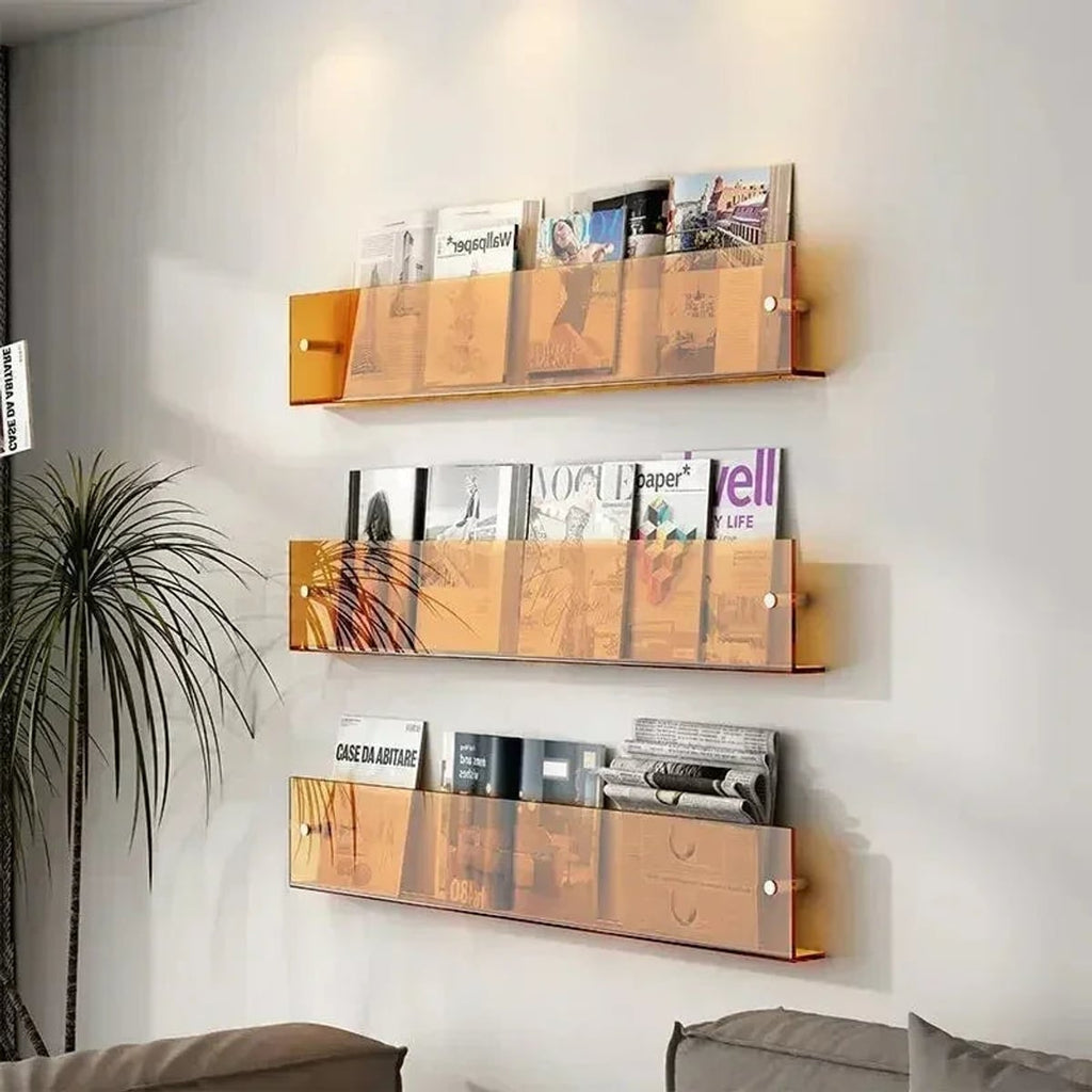 wall-mounted magazine and book display shelf in orange