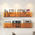 wall-mounted magazine and book display shelf in orange