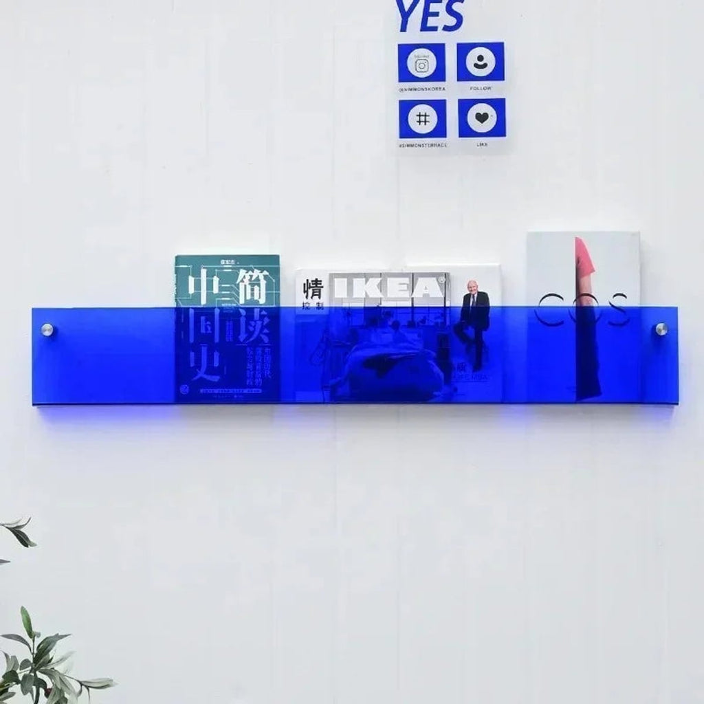 wall-mounted magazine and book display shelf in blue
